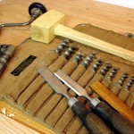 photo of drill bits, chisels, and hammer