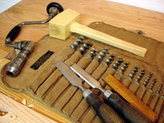 photo of drill bits, chisels, and hammer