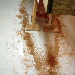 photo of shavings on the floor in the shape of a boat