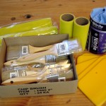 photo of brushes, rollers, spatulas and gloves