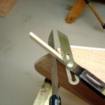 photo of sawing using a bevel gauge as a guide