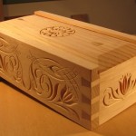 photo of box with carvings on all surfaces