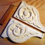 photo of shelf brackets with a wood carved acantus decoration