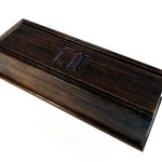 photo of a pencil box made of cherry with the initials E J E carved in the lid