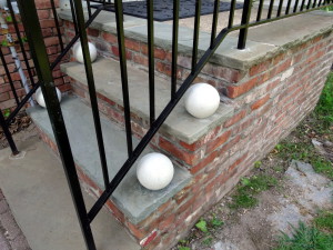 photo of garden globes under the railing
