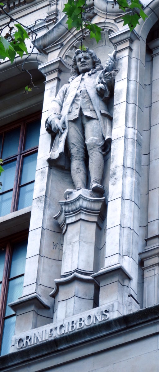 photo of a statue of Grinling Gibbons on the facade of the Victoria & Albert Museum, London