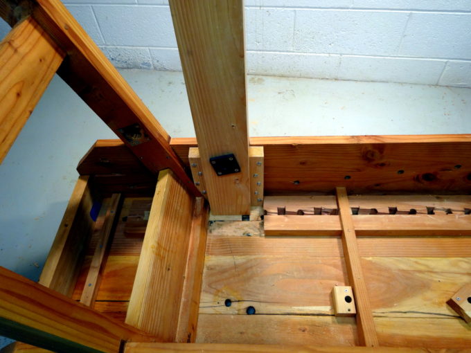 photo of leg bolted in place inside the bench