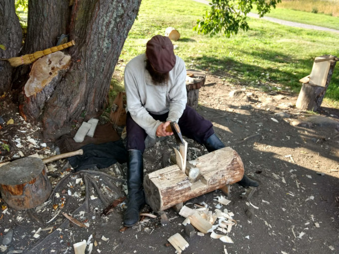 photo of Andrei carving a shingle