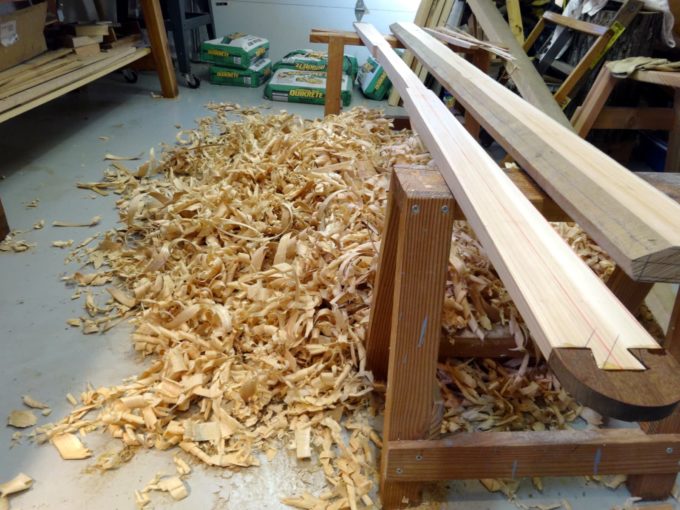 photo of pig pile of shavings and 2 partially done paddles