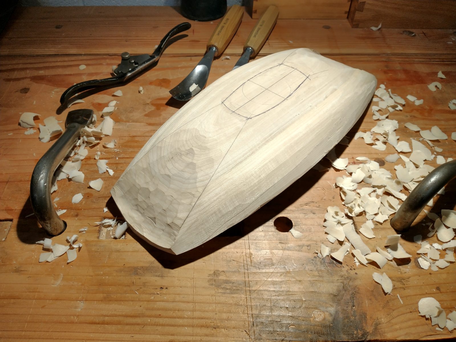 Photo of a rough carved bowl sitting on my workbench.
