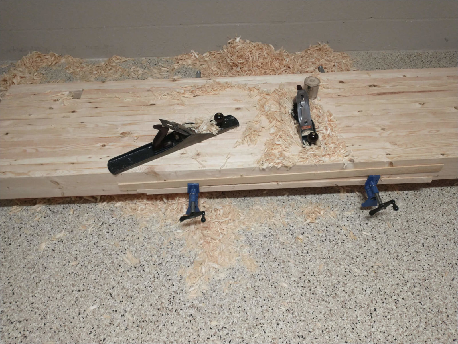 photo of planes flattening the bottom of the benchtop
