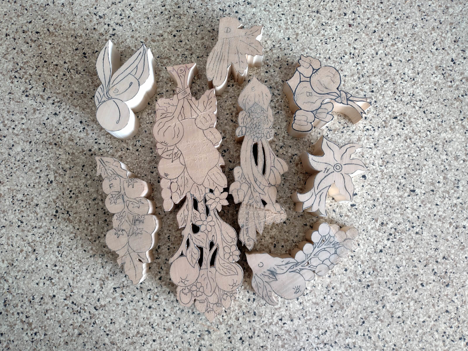photo of cut pieces for a Gibbons-like woodcarving